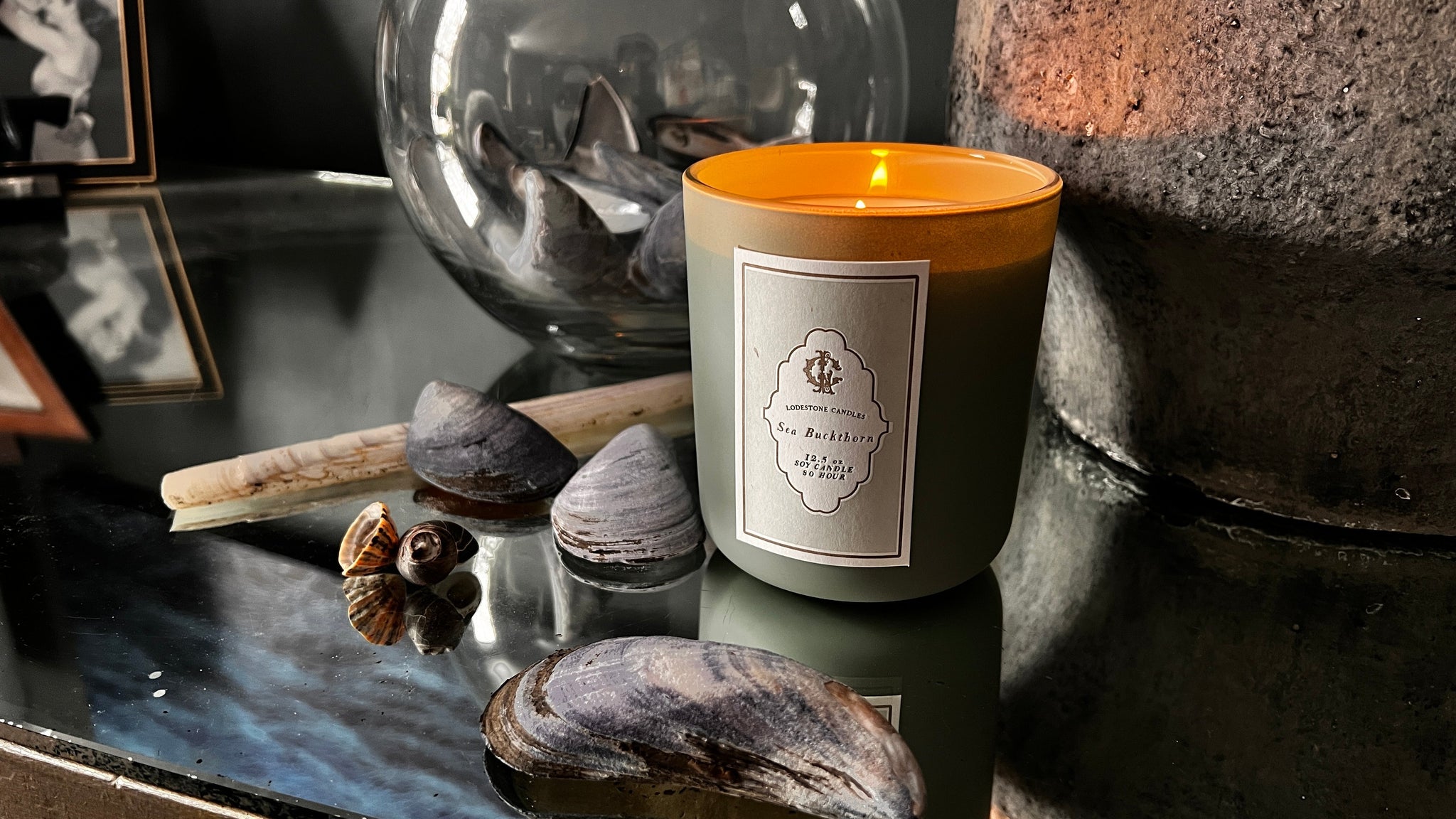Lodestone Candles Sea Buckthorn candle with watery, salt, and fresh top notes, floral jasmine and peony heart, and a musky base of seamoss and ambergris.
