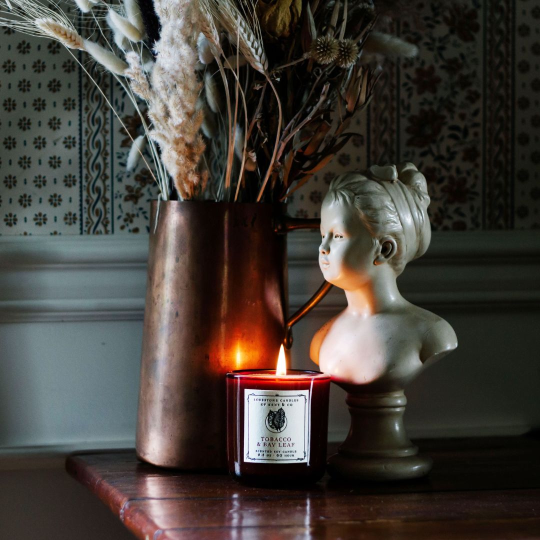 Lodestone Candles Tobacco & Bay Leaf candle with citrus and sandalwood.
