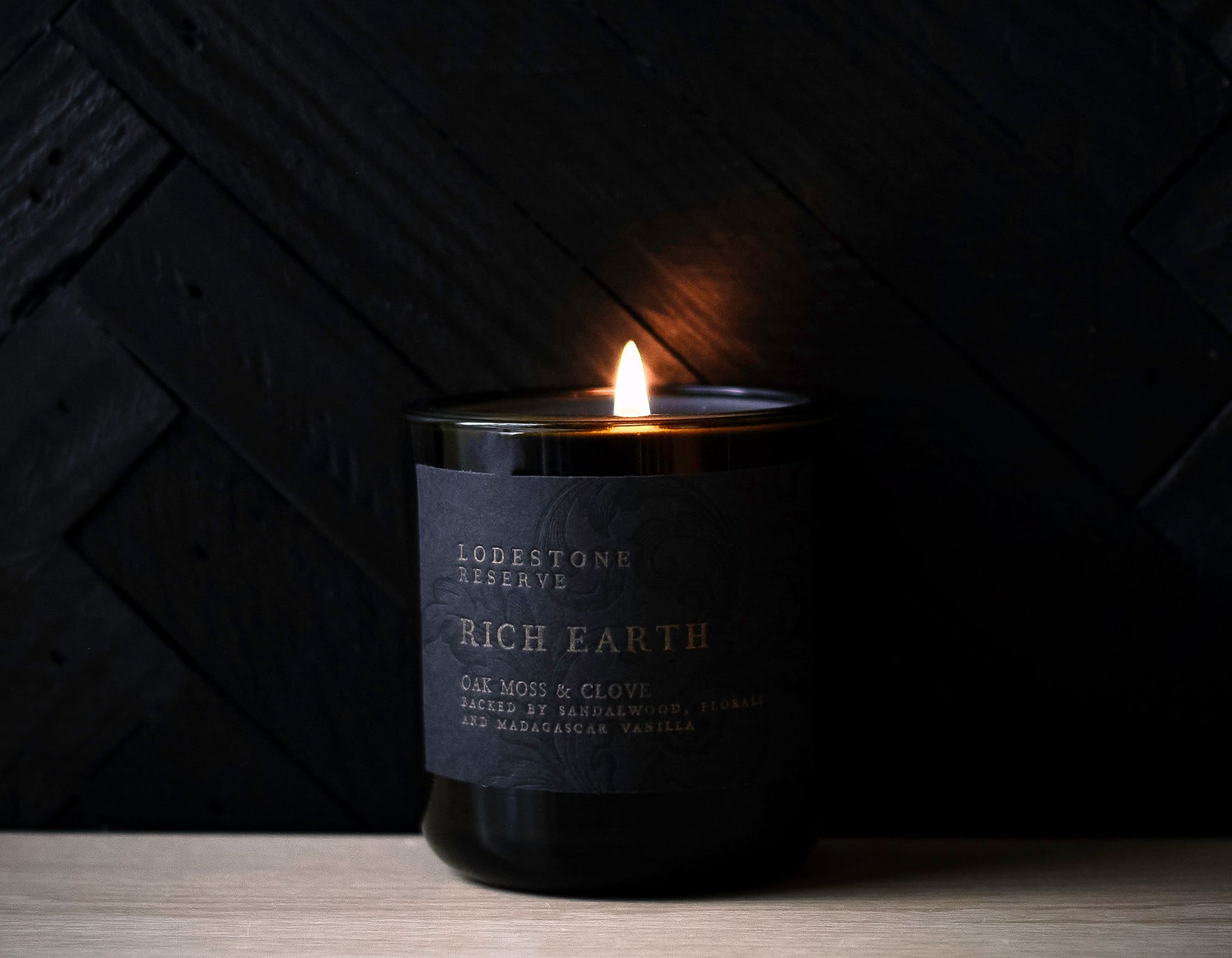 Lodestone Candles Rich Earth candle with cinnamon, clove, florals, oak moss, sandalwood, and Madagascar vanilla.