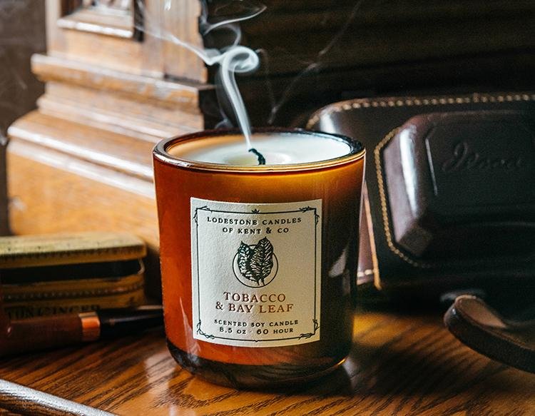 Lodestone Candles Tobacco & Bay Leaf candle with citrus and sandalwood.