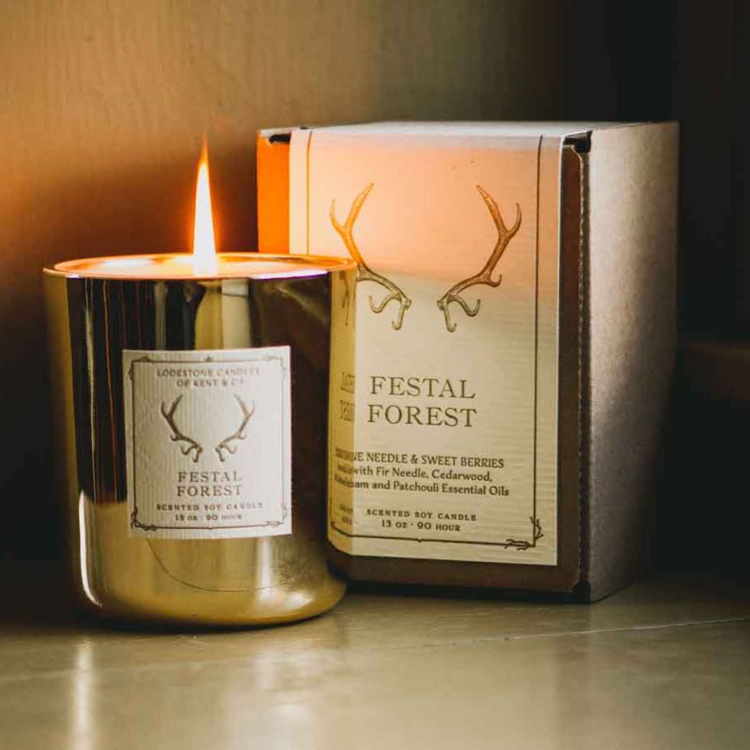 Lodestone Festal Forest candle with sweet berries and balsam woods.
