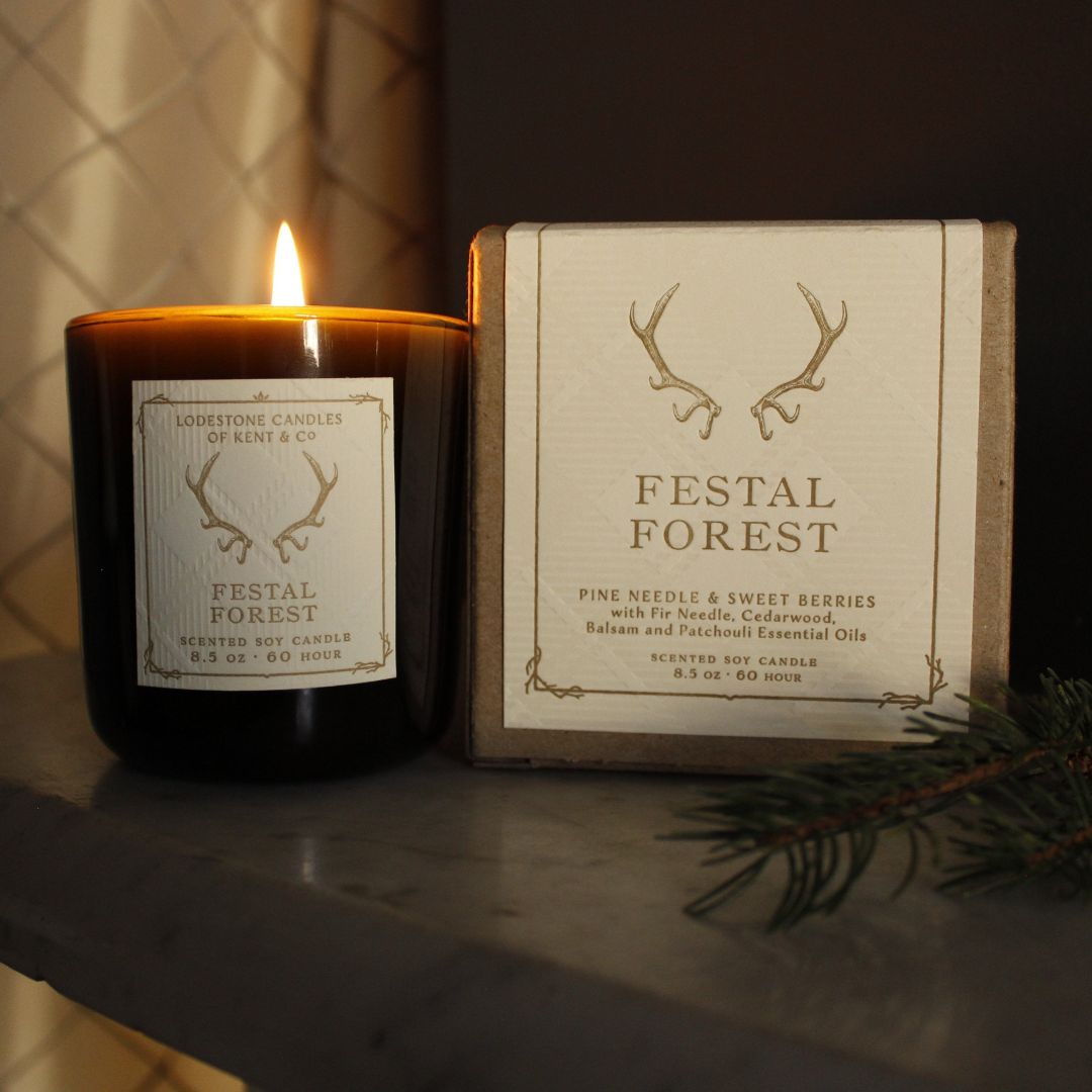 Lodestone Festal Forest candle with sweet berries and balsam woods.