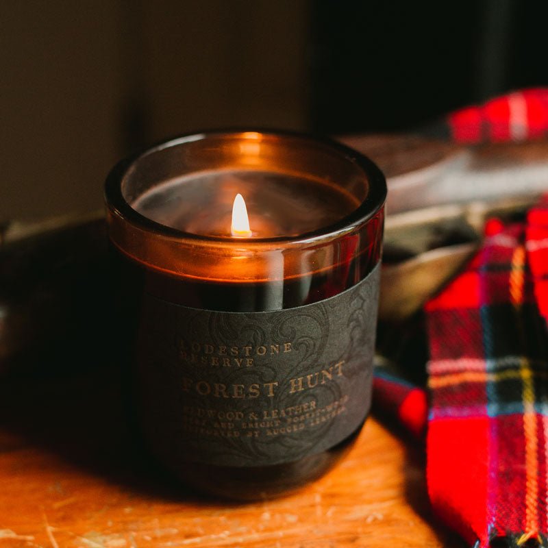 Lodestone Candles Forest Hunt candle with saffron, redwood, and amber.