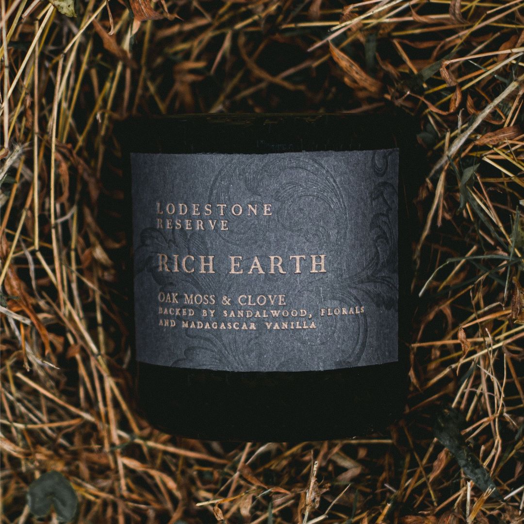 Lodestone Candles Rich Earth candle with cinnamon, clove, florals, oak moss, sandalwood, and Madagascar vanilla.
