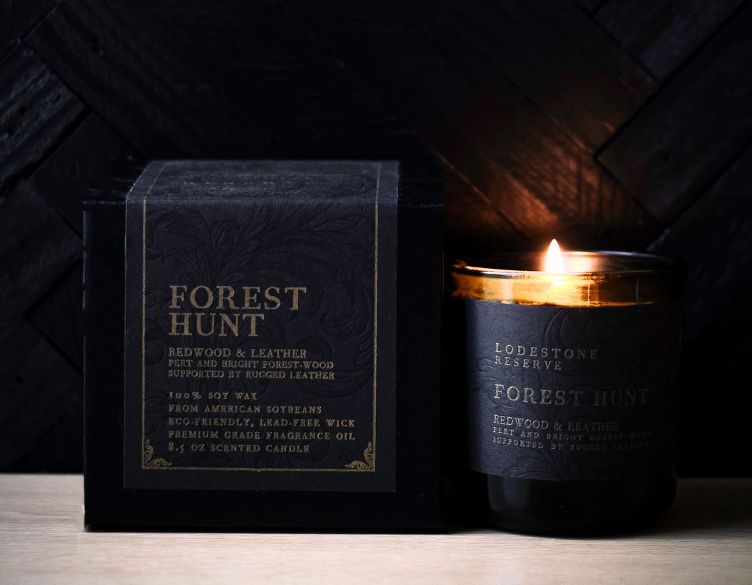 Lodestone Candles Forest Hunt candle with saffron, redwood, and amber.